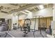 Well-equipped gym featuring a treadmill, stationary bikes, and various weightlifting machines for a complete workout at 20 Marietta Nw St # 7C, Atlanta, GA 30303