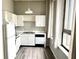 Functional kitchen with white cabinets, appliances, and ample counter space at 20 Marietta Nw St # 7C, Atlanta, GA 30303