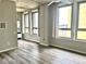 Bright living room featuring large windows, neutral walls and sleek flooring at 20 Marietta Nw St # 7C, Atlanta, GA 30303