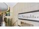 Elegant lobby entrance with marble walls, modern staircase, and The Metropolitan signage at 20 Marietta Nw St # 7C, Atlanta, GA 30303