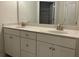Bathroom with double sinks, storage and a large mirror at 3706 Cheswolde Ave # 96, Powder Springs, GA 30127