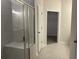 Bathroom featuring shower with glass doors, tile walls and a bench at 3706 Cheswolde Ave # 96, Powder Springs, GA 30127