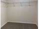 An empty carpeted walk-in closet with wire shelving for storage at 3706 Cheswolde Ave # 96, Powder Springs, GA 30127