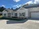 Charming single-story home with a brick and siding facade, well-maintained lawn, and a private two-car garage at 3706 Cheswolde Ave # 96, Powder Springs, GA 30127