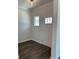 Bright foyer with hardwood flooring, a front door with glass panel, and a modern ceiling light at 3706 Cheswolde Ave # 96, Powder Springs, GA 30127