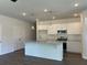 Bright kitchen featuring a central island, modern cabinetry, stainless steel appliances, and stylish pendant lights at 3706 Cheswolde Ave # 96, Powder Springs, GA 30127