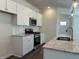 Modern kitchen features stainless steel appliances, white subway tile backsplash, and granite countertops at 3706 Cheswolde Ave # 96, Powder Springs, GA 30127