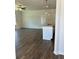 Open concept kitchen island featuring pendant lights, a sink, an eat-in counter, and hardwood floors at 3706 Cheswolde Ave # 96, Powder Springs, GA 30127