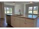 Kitchen island featuring a sink, stainless steel dishwasher, white cabinets, and granite countertops at 3706 Cheswolde Ave # 96, Powder Springs, GA 30127