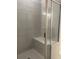 Glass enclosed shower with bench and tile design at 3706 Cheswolde Ave # 96, Powder Springs, GA 30127