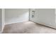 An empty bedroom with carpet floors, a window, and neutral colored walls at 721 Beaufort Cir, Duluth, GA 30096