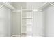 Inside a closet with shelves and white walls with off-white racks at 721 Beaufort Cir, Duluth, GA 30096