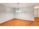 Bright dining room featuring hardwood floors and an elegant chandelier at 721 Beaufort Cir, Duluth, GA 30096