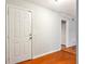 Bright foyer with beautiful hardwood floors and a closet for added storage and functionality at 721 Beaufort Cir, Duluth, GA 30096