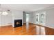 Inviting living room featuring a fireplace, hardwood floors, and doors that lead to the outside at 721 Beaufort Cir, Duluth, GA 30096