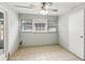 Sunroom with tile flooring, light paint, and natural light at 721 Beaufort Cir, Duluth, GA 30096