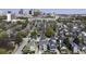 Aerial view of a neighborhood showcases homes with green trees and the city skyline in the distance at 78 Crumley Se St, Atlanta, GA 30312