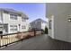 View of the wood back deck shows the home's backyard and the adjacent buildings at 78 Crumley Se St, Atlanta, GA 30312