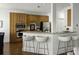 Eat-in kitchen featuring counter seating, stainless appliances, and natural wood cabinetry at 78 Crumley Se St, Atlanta, GA 30312