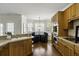 Well-equipped kitchen featuring wooden cabinets, stainless steel appliances, a breakfast bar, and cozy breakfast nook at 78 Crumley Se St, Atlanta, GA 30312