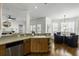 Open floor plan kitchen with breakfast bar, stainless steel dishwasher, and views of breakfast nook at 78 Crumley Se St, Atlanta, GA 30312