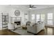 Bright living room with fireplace, hardwood floors, neutral furnishings and ample natural light, perfect for relaxing and entertaining at 78 Crumley Se St, Atlanta, GA 30312