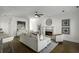 Open-concept living area with barstool seating, hardwood flooring, fireplace and neutral furniture is great for entertaining at 78 Crumley Se St, Atlanta, GA 30312