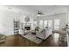 Bright living room featuring a fireplace, hardwood floors, neutral furnishings and ample natural light, perfect for relaxing and entertaining at 78 Crumley Se St, Atlanta, GA 30312