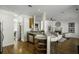 Bright and airy open floor plan living room with eat in kitchen, fireplace, and hardwood floors at 78 Crumley Se St, Atlanta, GA 30312