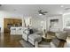 Open-concept living space with sleek kitchen, modern furnishings, hardwood floors, and ample seating perfect for entertaining at 78 Crumley Se St, Atlanta, GA 30312