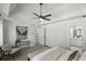 Bright main bedroom featuring a tray ceiling, neutral decor, and an en-suite bathroom at 78 Crumley Se St, Atlanta, GA 30312