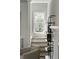 Bright hallway featuring a staircase, light and airy design, and decorative shelving at 78 Crumley Se St, Atlanta, GA 30312
