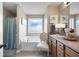 Relaxing bathroom with a soaking tub, frosted window, and vanity with ample counter space at 102 Autumn Brooke Trl, Dallas, GA 30157