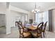 Elegant dining room with hardwood floors, decorative table setting, and natural lighting at 102 Autumn Brooke Trl, Dallas, GA 30157