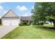Charming home with a well-manicured lawn, beautiful landscaping, and an attached two car garage at 102 Autumn Brooke Trl, Dallas, GA 30157