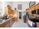 Charming kitchen featuring wooden cabinetry, stainless steel appliances, and tile flooring at 102 Autumn Brooke Trl, Dallas, GA 30157