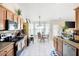 Bright kitchen with a breakfast nook, stainless steel appliances, and tiled flooring at 102 Autumn Brooke Trl, Dallas, GA 30157