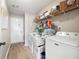Functional laundry room with washer, dryer, and ample storage space at 102 Autumn Brooke Trl, Dallas, GA 30157