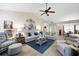 Spacious living room with hardwood floors, comfortable seating, and a ceiling fan at 102 Autumn Brooke Trl, Dallas, GA 30157