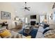 Comfortable living room featuring a fireplace, plush seating, and a ceiling fan at 102 Autumn Brooke Trl, Dallas, GA 30157