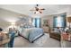 Serene main bedroom with a tray ceiling, blue curtains, and neutral-toned decor at 102 Autumn Brooke Trl, Dallas, GA 30157