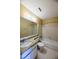 This is a well-lit bathroom with a large mirror, a granite countertop, and a bathtub at 1606 Parkaire Xing # 1606, Marietta, GA 30068