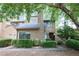 Inviting townhouse featuring a neutral color, a chimney, and lush landscaping at 1606 Parkaire Xing # 1606, Marietta, GA 30068