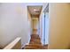 Upstairs hallway featuring hardwood floors and neutral paint at 1606 Parkaire Xing # 1606, Marietta, GA 30068