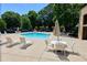 This is an outdoor pool with lounge chairs and tables at 1606 Parkaire Xing # 1606, Marietta, GA 30068