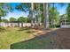 Backyard featuring mature trees and partial fence line at 561 Sybil Se Ln, Marietta, GA 30067