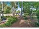 Private backyard featuring mature trees, shed, and lush landscaping at 561 Sybil Se Ln, Marietta, GA 30067