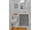 Compact bathroom with a gray vanity, toilet, and tub/shower combo at 561 Sybil Se Ln, Marietta, GA 30067