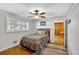 Comfortable bedroom with a ceiling fan, hardwood floors, and ample natural light at 561 Sybil Se Ln, Marietta, GA 30067