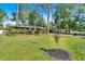 Charming brick home with lush landscaping and a covered carport set on a well-manicured lawn at 561 Sybil Se Ln, Marietta, GA 30067